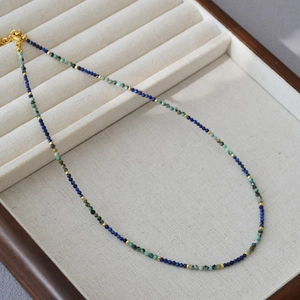 Handmade beaded necklace with turquoise and lapis lazuli beads and gold metal clasp