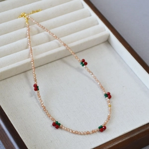 Elegant beaded necklace with champagne zircon and cute cherry pattern details