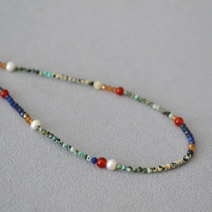 Handmade necklace with lapis lazuli, small colorful gemstones and freshwater pearls