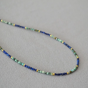 Handmade beaded necklace with turquoise, lapis lazuli and gold metal accents for women