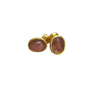 Minimalist gold-plated brass oval stud earrings featuring translucent reddish-brown natural stone