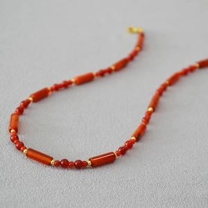 Retro red agate beaded necklace with gold spacers and lobster clasp in a warm autumn style