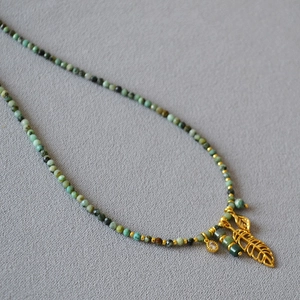 French vintage necklace with turquoise beads and golden leaf pendant bohemian style