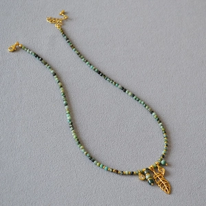 French vintage necklace with green turquoise beads and golden hollow leaf pendant