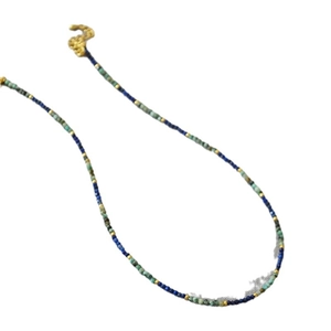 Handmade beaded necklace with turquoise and lapis lazuli stones on a white background