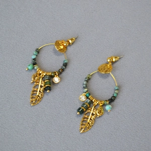 Bohemian gold hoop earrings with green beads, hollow leaf charms, and crystal accents