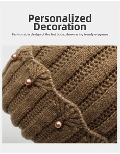 Detailed close-up of brown knit hat featuring pink pearl accents and silver stitching