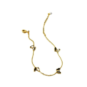 Bracelet papillon en laiton doré avec breloques en émail bicolore et détail de perle