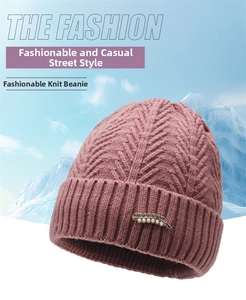 Macro shot of thick winter knit hat showing fleece texture and elegant pearl rhinestone decor