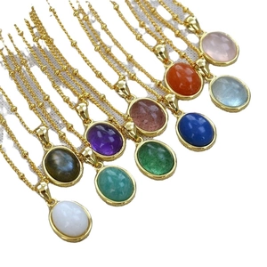Collection of oval natural stone pendant necklaces in various colors with gold chain