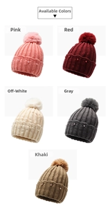 Detail view of pearl-studded knit hats with faux fur pom-poms in five colors