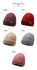 Detailed display of five colors of winter fleece-lined knit hats with pearl feather brooches