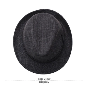 Top down view of dark grey fedora hat with textured weave and black decorative band