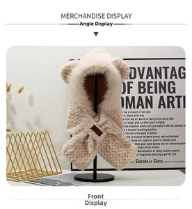 Front detail of beige bear ear hat featuring plush fox fur trim and knit texture