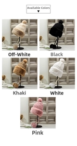 Detail view of thickened knit hats with faux fur trim and pom-poms in five colors