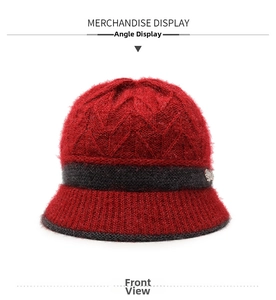 Detail of red knit bucket hat featuring diamond texture and grey rhinestone band