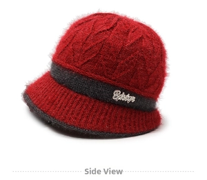 Detailed view of the red winter knit hat featuring warm thick cable textures and logo