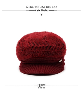 Detail view of wine red winter knit hat with soft faux rabbit fur and rhinestone insect pin