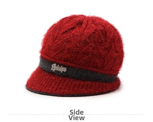Detail of red knit hat for elderly women showing soft faux mink texture and rhinestone decor