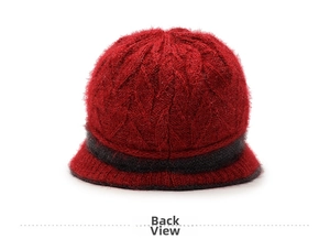 Close-up back view of dark red knitted warm winter bucket hat with thick wool texture