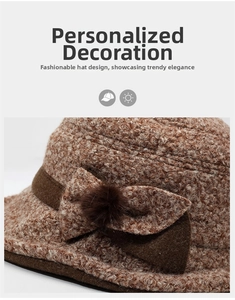 Detail of winter knit bucket hat featuring a brown bow accent and a soft faux fur pom-pom