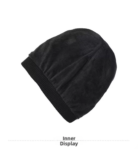 Detail view of the warm black fleece lining and ribbed edge of this winter knitted beanie