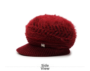 Side view of dark red winter knit hat with plush faux fur and rhinestone detail