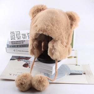 Thick plush bear ear aviator hat for women in camel brown with fuzzy pompom drawstrings