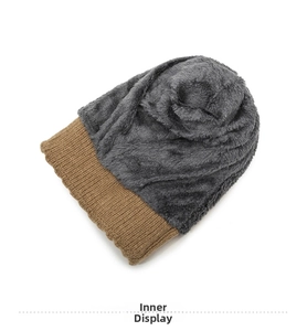 Detail view of winter knitted hat showing the warm thick brown yarn and grey plush lining