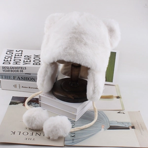 Furry white bear ear trapper hat with pom-poms for winter warmth and cute style