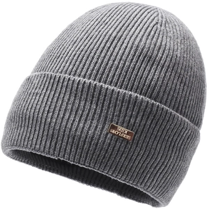 Close-up of grey rib-knit beanie showing the thick texture and brown brand tag detail