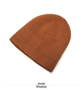 Close-up of the high-quality brown knit beanie showing fine interior stitching and texture