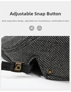 Detail of adjustable metal buckle and leather strap on herringbone flat cap