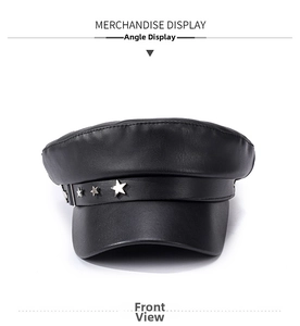Detail of black PU leather flat top hat with metallic star rivets and silver buckle
