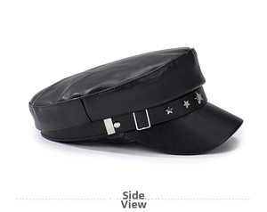 Side view of black PU leather baker boy hat featuring silver star studs and metal buckle