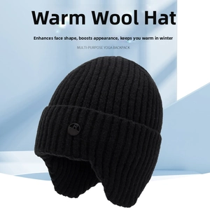 Detail of black winter knit hat featuring vertical ribs and circular R logo badge