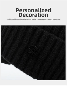 Detailed close-up of black knitted beanie showing thick textured fabric and round logo tag