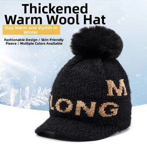 Detailed view of winter chenille knit hat with pompom and warm fleece lining