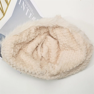 Detail of soft beige faux fur texture on thickened winter bear hat with warm plush lining