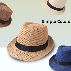 Detail of woven fedora hats in various colors with black decorative ribbon bands