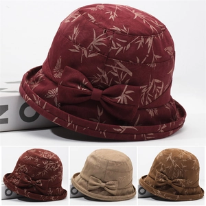Close-up of elegant floral print bucket hats for elderly women with bow detail