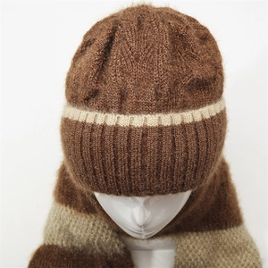 Detailed knit texture of a brown and beige mohair blend winter hat with scarf set