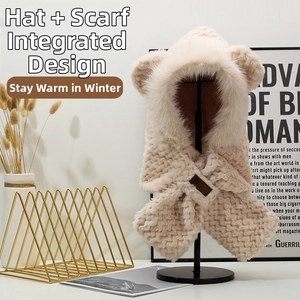 Detail of cream plush teddy ear hood with faux fur trim and integrated scarf