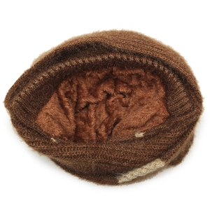 Detailed view of the thick brown knit exterior and soft faux fur lining for winter warmth