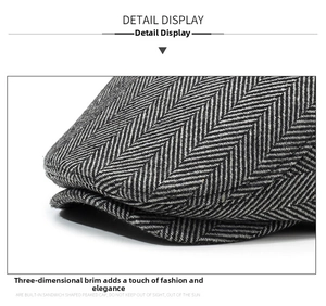 Detailed macro view of herringbone pattern fabric and stitching on a vintage newsboy cap