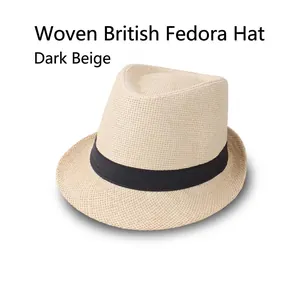 Detail of dark beige woven fedora hat with a black decorative ribbon band on white background