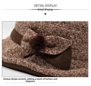 Detailed view of brown knit bucket hat with textured fabric and elegant side bow detail