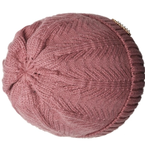 Detailed knit texture of rose pink winter hat with golden pearl metal accessory