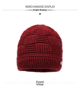Detailed front view of a wine red chunky knit beanie with thick fleece lining