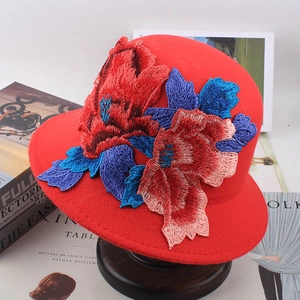 Red wool bucket hat with ethnic floral embroidery and stylish round top design